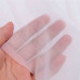 Флизелин водорастворимый для вышивки показана прозрачность материала на фоне руки.