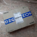 Коробка для озон перевязанная скотчем с логотипом ozon с упакованным товаром из интернет-магазина.
